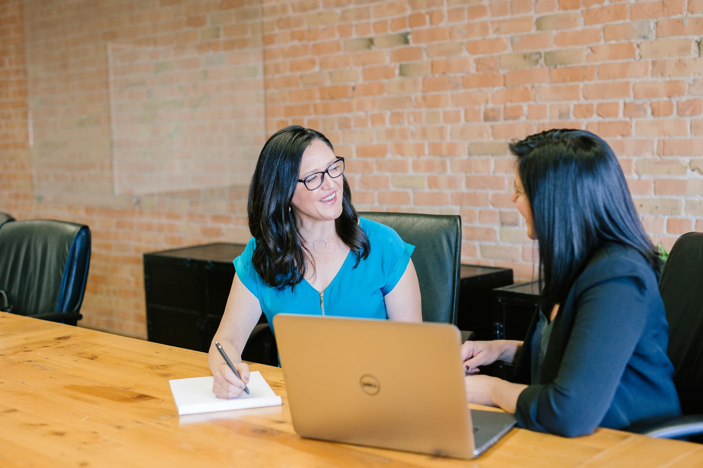 Two business leaders working through a plan